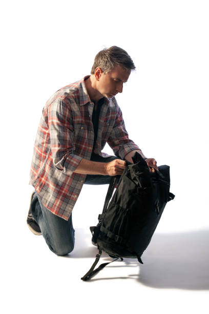 istock Tourist or Hiker Preparing a Bag During Sunset 1156809414