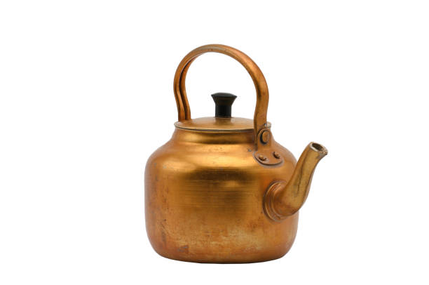 istock Golden metal kettle on a white background.Teapot. 1156813776