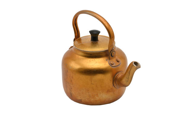 istock Golden metal kettle on a white background.Teapot. 1156813780