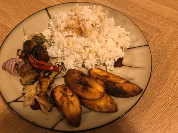 istock Plantains, rice and charred vegetables 1156814016