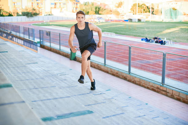 istock Young man running upstairs on stadium 1156819084
