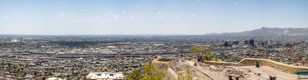 El Paso, Texas, USA - June 03, 2019: Visitors are taking photo with downtown and international border in the background. El Paso is western most city in Texas and Ciudad is located south of the border.