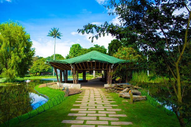 istock Colorful garden with kiosk and lake 1156820380