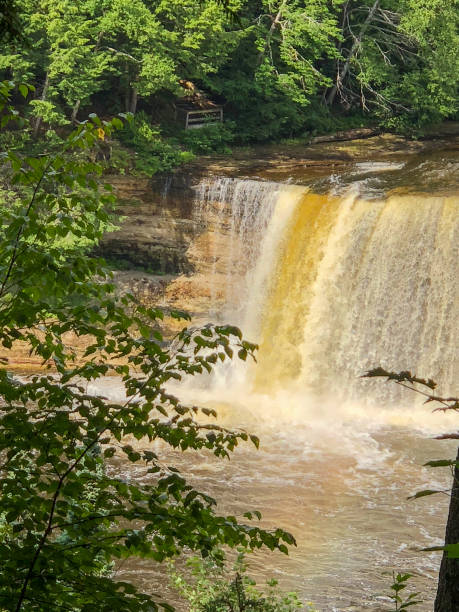 istock Yellow and white wide waterfall in Michigan 1156822749