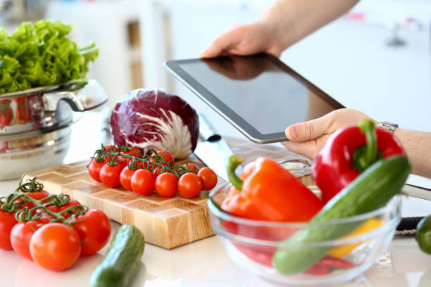 istock Chef Hands Recording Organic Salad Vegetables 1156822821