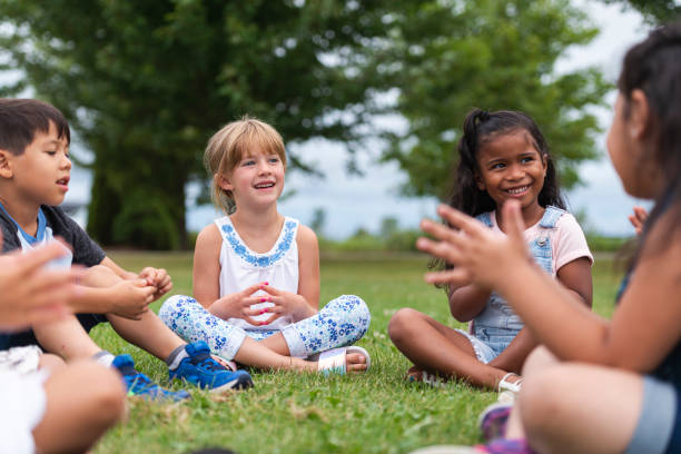 istock A Multi-Ethnic Group of Young Children are Clapping Outside 1156823651