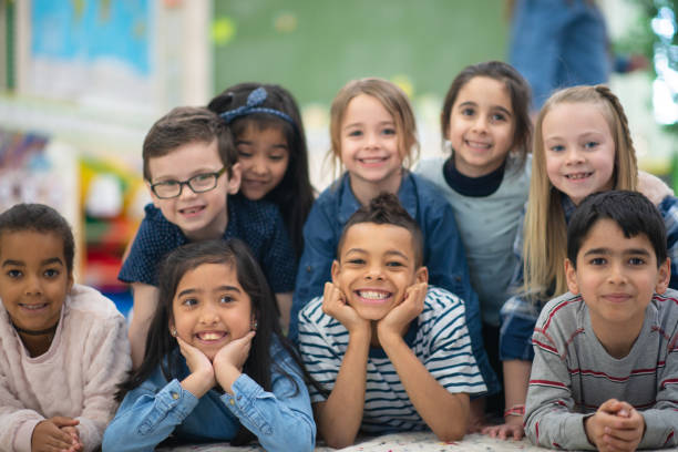 istock Group portrait of smiling elementary kids 1156824216
