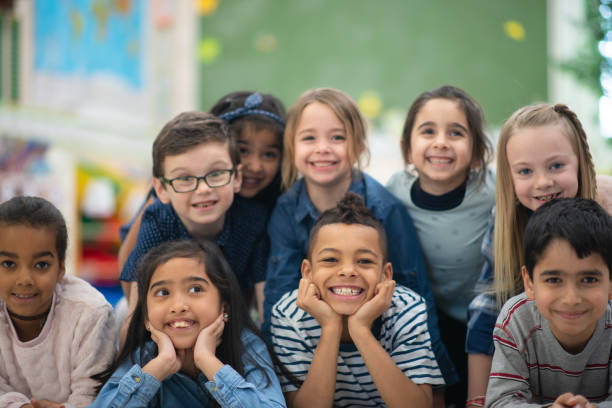 istock Group portrait of smiling elementary kids 1156824219