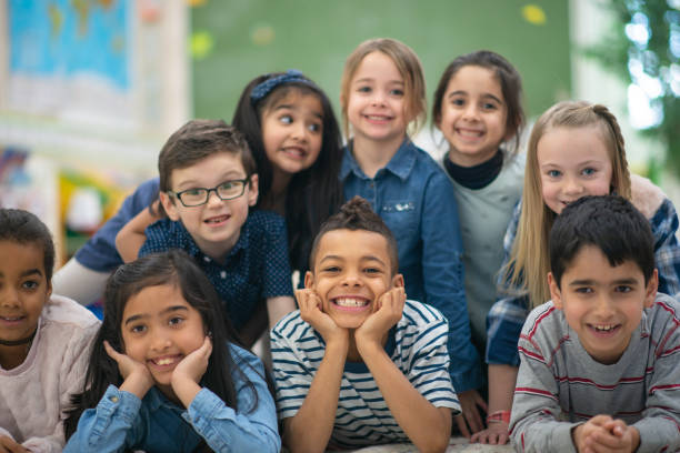 istock Group portrait of smiling elementary kids 1156824220