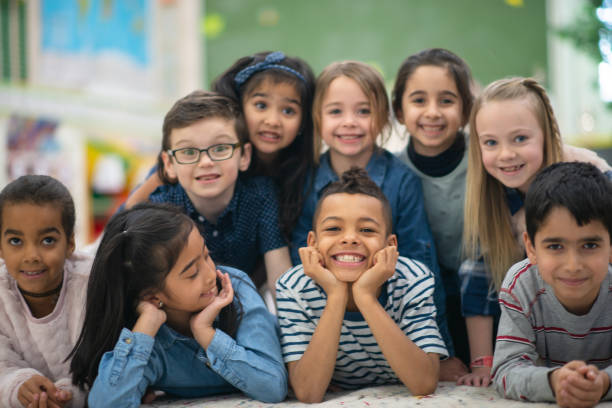 istock Group portrait of smiling elementary kids 1156824221