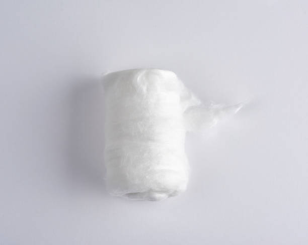 istock white medical cotton twisted into a roll on a white background 1156829597