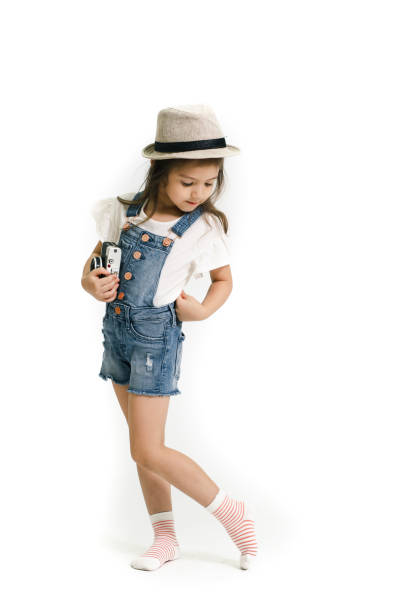 Portrait of cute little girl isolated on white background. stock photo