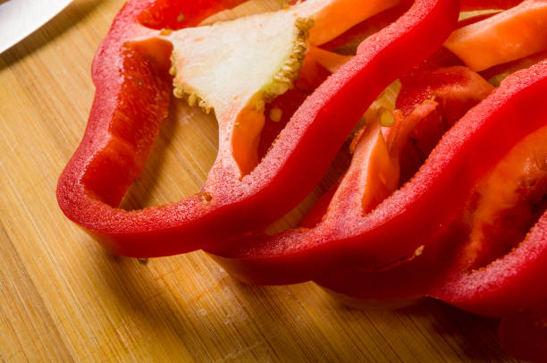 istock sliced fresh red paprika, bell pepper on bamboo cutting board 1156830924
