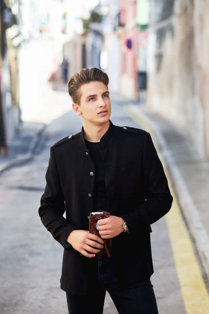 istock Young handsome man wearing black clothes 1156833899