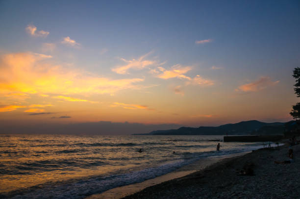 Summer sea sunset, the sun, waves and clouds, beautiful dramatic lighting