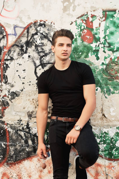 istock Young elegant man wearing black clothes 1156834170