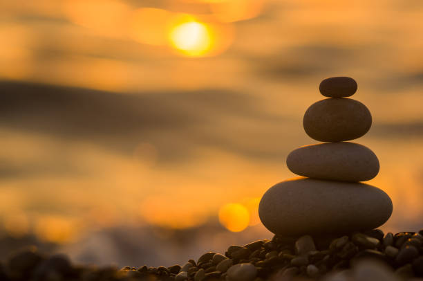 istock stack of zen stones on pebble beach 1156834835