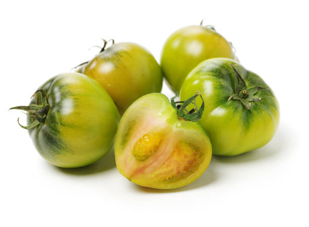 istock fresh green tomato isolated on white background 1156836876