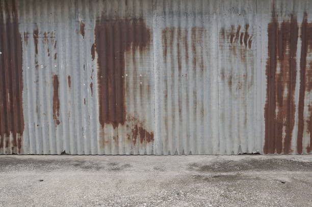 istock Old zing wall,background of peeling paint and rusty old metal.zinc wall texture pattern background rusty corrugated metal old decay. 1156837450