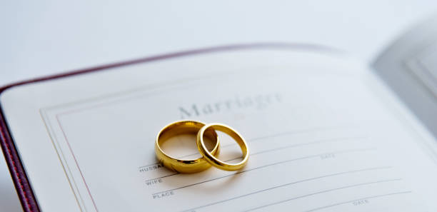 Two wedding rings on the holy bible Two wedding rings on the holy bible. honeymoon book stock pictures, royalty-free photos & images