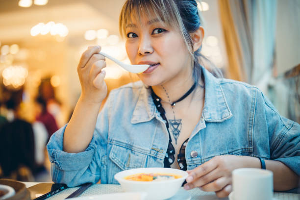istock Happy Asia girl enjoying lunch 1156845006