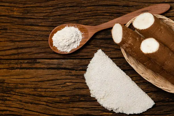 Beiju of tapioca, cassava-based dish typical of the northeastern region of Brazil, now consumed in the whole country on old wooden background.