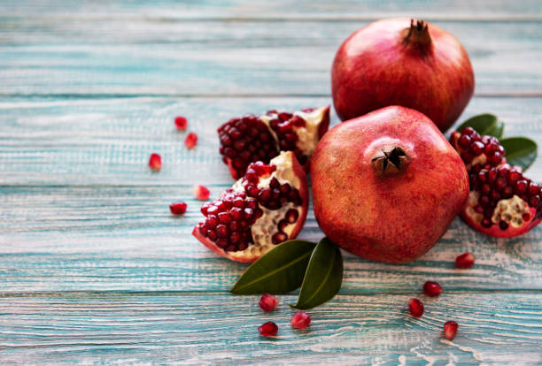 istock Ripe pomegranate fruits 1156855788
