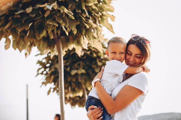 istock Mother with son playing in a summer park 1156860981