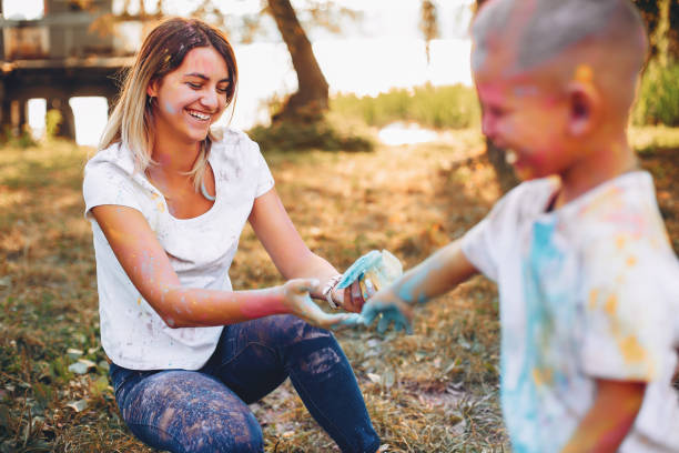 istock Mother with son playing in a summer park 1156861476