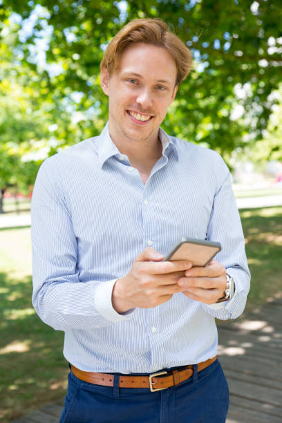 istock Joyful young entrepreneur happy to use new mobile app 1156862983