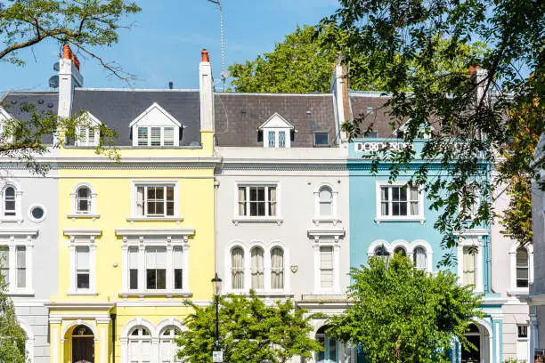 Colourful English Victorian Houses in Notting Hill, a district in West London in the Borough of Kensington and Chelsea