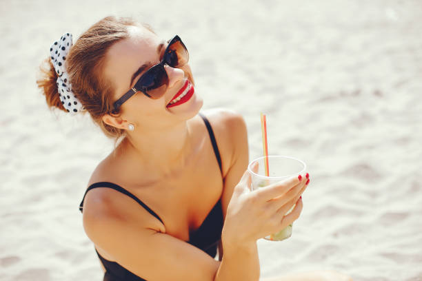 istock Elegant woman in a sunny beach 1156863898