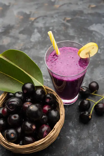 Photo of Juice of jamun fruit in a glass also called as java plum, jambolan plum, jambhul, syzygium cumini