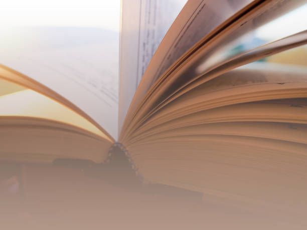 istock a stack of books and one is open, concept learning, school, University, training and knowledge 1156866592