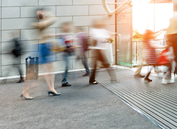 istock Business people walking in a modern interior, blurred motion 1156866778
