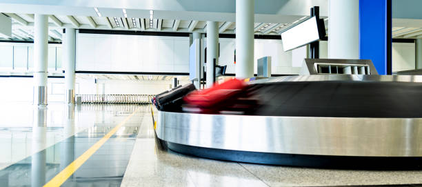istock Luggages moving on airport conveyor belt 1156866856