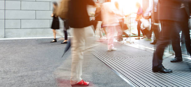 istock Business people walking in a modern interior, blurred motion 1156866857