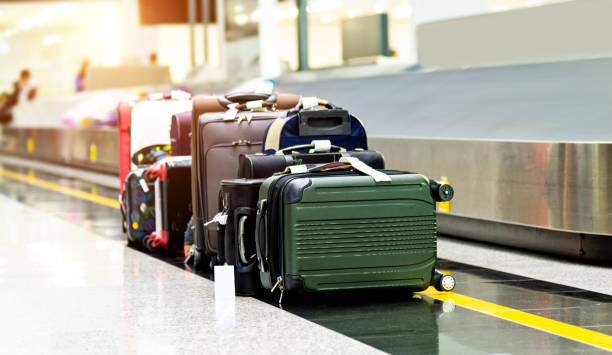 istock Luggages moving on airport conveyor belt 1156866896