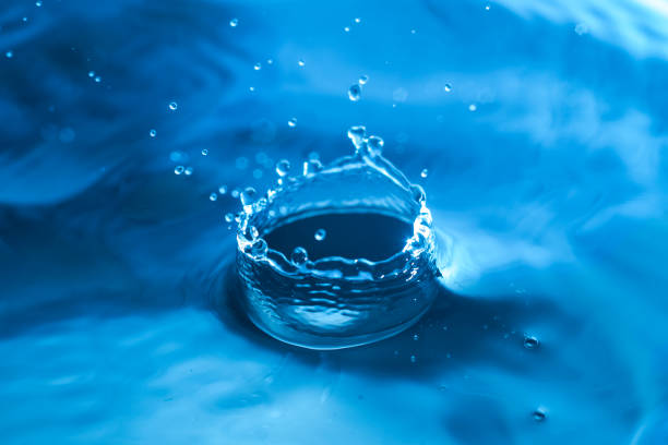 istock Drop of water. Blue water drop. Water splash close-up. 1156867011