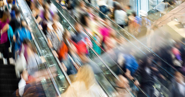 istock Crowed people in blurred motion on Escalator 1156867232