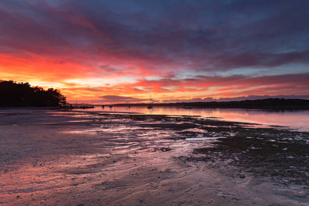 istock Colourful Cloudy River Sunrise Waterscape 1156868131