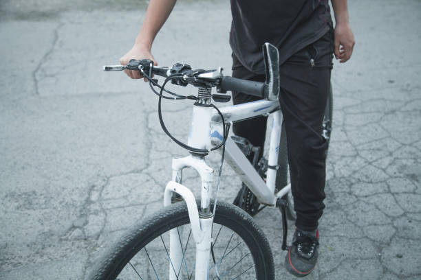 istock Caucasian boy riding bicycle at asphalt. 1156871613