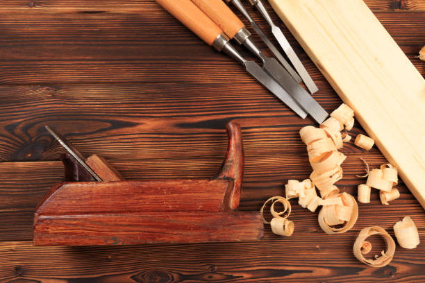 istock chisels plane and sawdust on a wooden table - Image 1156871916