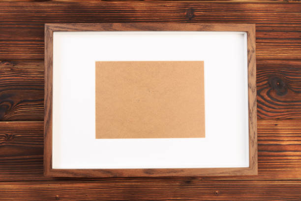 istock wooden frame on wooden desk - Image 1156871920