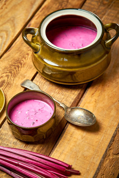 istock Old vase with  cold beetroot soup and spoon on rustic wooden table 1156871923