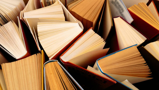 istock Old and used hardback books  top view - Image 1156871968
