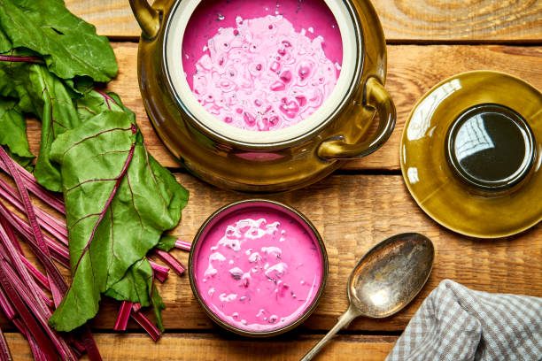 istock Old vase with  cold beetroot soup and spoon on rustic wooden table 1156872112