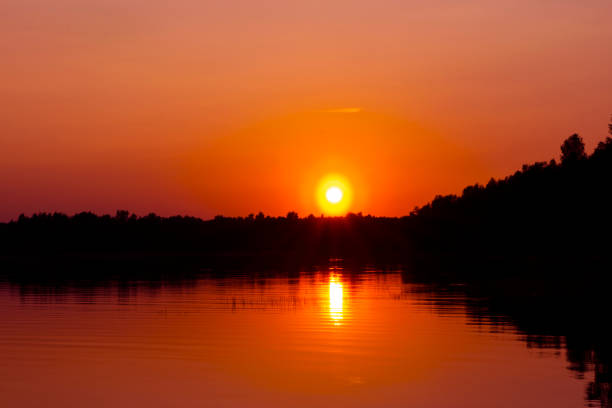 Sunset sky background. Dramatic gold sunset sky with evening sky clouds over the sea. Stunning sky clouds in the sunset. Sky landscape. Panoramic sky view.