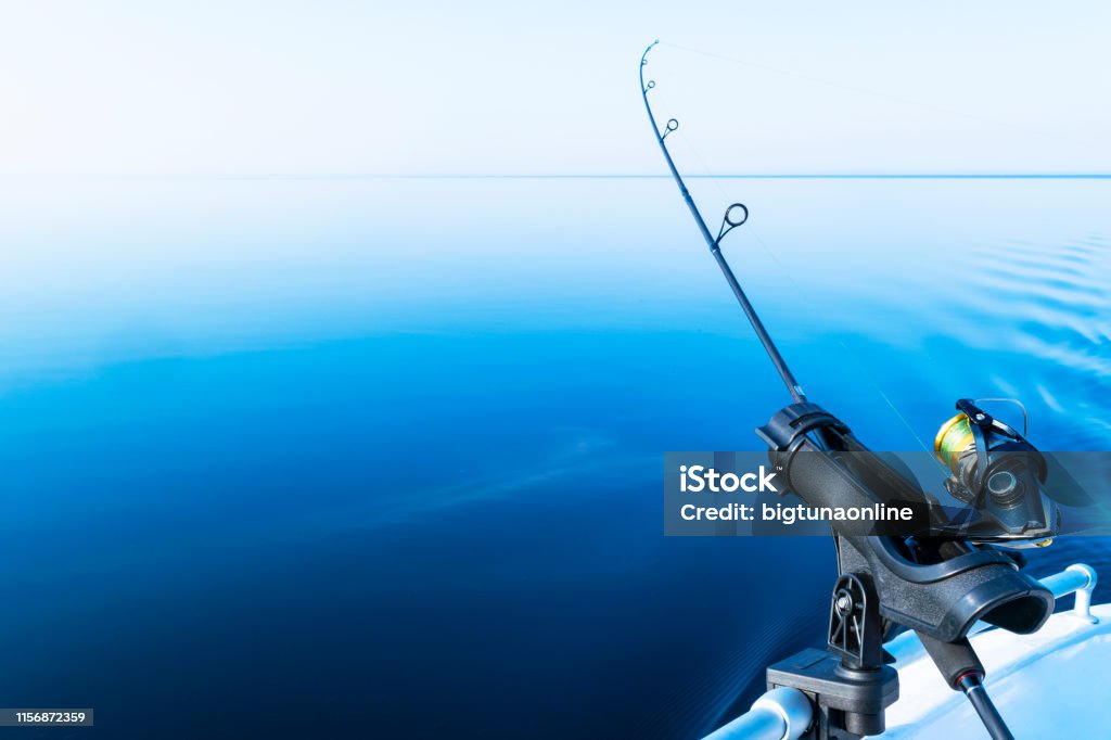 Fishing Rod Spinning With The Line Closeup Fishing Rod In Rod Holder In  Fishing Boat Due The Fishery Day Fishing Rod Rings Fishing Tackle Fishing  Spinning Reel Stock Photo - Download Image