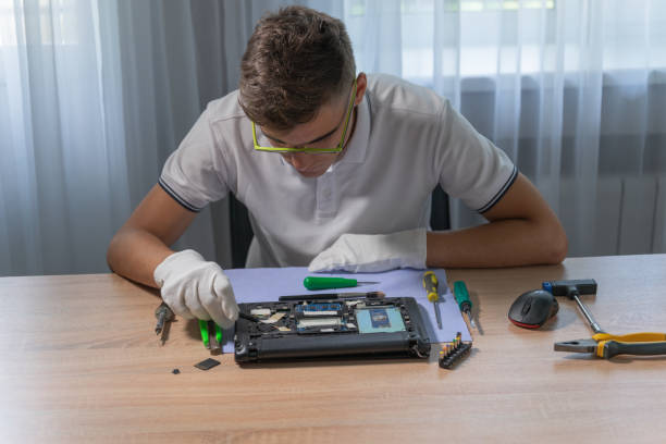 Laptop repair at home. Smart teen is repairing pc Laptop repair at home. Smart teen is repairing pc installing laptop ram stock pictures, royalty-free photos & images